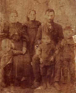 Grandfather Mendel Menakhin, his wife and senior sons.